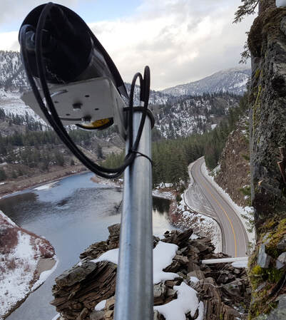 Landslide Technology's instrumentation system monitoring a rock slope above a Montana Highway.